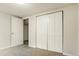 Bedroom with carpeted floor and a closet with doors at 405 Cypress St, Broomfield, CO 80020