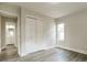 Bedroom with a double closet, neutral colors, and a window at 405 Cypress St, Broomfield, CO 80020