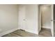 Bedroom featuring light gray flooring, a white door, and a neutral color palette at 405 Cypress St, Broomfield, CO 80020
