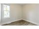 Bedroom featuring a neutral color palette, window, and baseboard trim at 405 Cypress St, Broomfield, CO 80020
