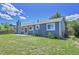 This home has a well-maintained backyard with a concrete patio and a beautiful lawn area at 19155 E Kansas Dr, Aurora, CO 80017