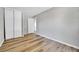 Bedroom with hardwood floors, white trim and closet at 19155 E Kansas Dr, Aurora, CO 80017