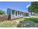 Well-kept property with a blue siding, and fresh landscaping providing a serene and inviting setting at 19155 E Kansas Dr, Aurora, CO 80017