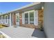 This home features a charming brick accent, inviting front porch, and pleasant curb appeal at 19155 E Kansas Dr, Aurora, CO 80017