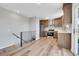 This kitchen has light wood floors, granite countertops and stainless steel appliances, offering a practical and stylish cooking area at 19155 E Kansas Dr, Aurora, CO 80017