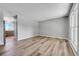 Open floor plan features a spacious living room and kitchen view with light wood floors at 19155 E Kansas Dr, Aurora, CO 80017