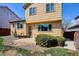 Back exterior showcasing outdoor living with patio and mature landscaping at 9652 Cove Creek Dr, Highlands Ranch, CO 80129