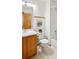 Bathroom featuring a toilet, vanity with framed mirror, and decorative wall art at 9652 Cove Creek Dr, Highlands Ranch, CO 80129
