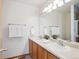 Bright bathroom featuring a double vanity with modern fixtures and ample storage at 9652 Cove Creek Dr, Highlands Ranch, CO 80129