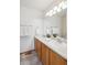 Modern bathroom featuring a double vanity with modern fixtures and ample lighting at 9652 Cove Creek Dr, Highlands Ranch, CO 80129