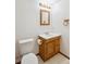 This bathroom has an updated vanity, toilet, mirror and good lighting at 9652 Cove Creek Dr, Highlands Ranch, CO 80129