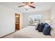 Bright bedroom with a large window and ensuite bathroom with light fixtures at 9652 Cove Creek Dr, Highlands Ranch, CO 80129