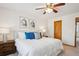 Well-lit bedroom with a cozy bed, bedside tables, and tasteful decor at 9652 Cove Creek Dr, Highlands Ranch, CO 80129