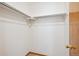 Spacious walk-in closet with shelving and ample storage space for clothing at 9652 Cove Creek Dr, Highlands Ranch, CO 80129