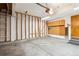 Spacious garage with concrete floors and ample space for storage at 9652 Cove Creek Dr, Highlands Ranch, CO 80129