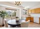 Kitchen and eating area with views of the backyard through the windows at 9652 Cove Creek Dr, Highlands Ranch, CO 80129