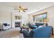 Spacious living room featuring a fireplace and large window at 9652 Cove Creek Dr, Highlands Ranch, CO 80129