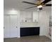 Living room showcasing new hardwood floors, built-in cabinets with quartz countertops, and modern ceiling fan at 2545 S Leyden St, Denver, CO 80222