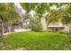 Lush green backyard with trees and fence at 940 Kearney St, Denver, CO 80220