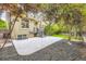 Backyard with well-manicured lawn, trees and patio at 940 Kearney St, Denver, CO 80220