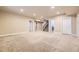 This spacious basement has neutral paint, plush carpet, and multiple entry points at 940 Kearney St, Denver, CO 80220