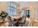Bright dining room with large windows, an elegant table, and an inviting atmosphere perfect for gatherings and meals at 940 Kearney St, Denver, CO 80220