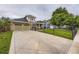Inviting two-story home featuring a well-manicured lawn, a charming balcony, and a spacious two car attached garage at 940 Kearney St, Denver, CO 80220