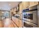 Gourmet kitchen with stainless steel appliances, custom cabinets, and a seamless design for efficient cooking and entertaining at 940 Kearney St, Denver, CO 80220