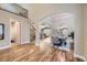 Open-concept living area with hardwood floors and staircase at 940 Kearney St, Denver, CO 80220
