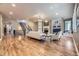 Spacious living room featuring a fireplace, built-in bookshelves, and stairs to the second floor at 940 Kearney St, Denver, CO 80220