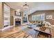 Cozy living room features a fireplace, built-in bookshelves, and large windows at 940 Kearney St, Denver, CO 80220