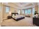 Spacious main bedroom boasts tray ceiling, sitting area, and large windows with ample natural light at 940 Kearney St, Denver, CO 80220
