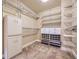 Walk-in closet with built-in shelving, drawers, and storage units for optimal organization at 940 Kearney St, Denver, CO 80220