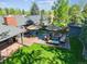 Aerial view of the backyard featuring a spacious wood deck with outdoor seating and a lush lawn at 2774 S Milwaukee St, Denver, CO 80210
