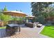Backyard wood deck featuring plush outdoor seating, a dining table, and a storage shed at 2774 S Milwaukee St, Denver, CO 80210