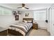 Cozy bedroom featuring striped bedding, ceiling fan, and natural light, creating a relaxing retreat at 2774 S Milwaukee St, Denver, CO 80210