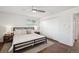 Bright bedroom with a ceiling fan, wood floors, a bed and a closet at 2774 S Milwaukee St, Denver, CO 80210