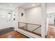 Bright foyer with hardwood floors, modern railing, and a welcoming entrance at 2774 S Milwaukee St, Denver, CO 80210