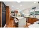 Modern kitchen with a center island, stainless steel appliances, and custom cabinets at 2774 S Milwaukee St, Denver, CO 80210