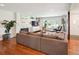 Cozy living room with a fireplace, built-in shelving, and hardwood floors at 2774 S Milwaukee St, Denver, CO 80210