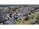 Backyard featuring a detached garage, garden beds, and partial fencing with city views at 1108 Roslyn St, Denver, CO 80220