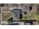 Overhead view of the home shows the roofline, detached garage, and yard, emphasizing lot layout and size at 1108 Roslyn St, Denver, CO 80220