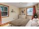 Bedroom with hardwood floors, two windows, neutral walls and decor at 1108 Roslyn St, Denver, CO 80220