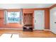 Inviting entryway featuring hardwood floors, a coat rack with bench, and a bright window providing natural light at 1108 Roslyn St, Denver, CO 80220