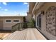 Private wooden back deck with railing and beautiful views at 1172 S Steele St, Denver, CO 80210