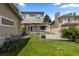 Private backyard with lawn, wood deck, and garden at 1172 S Steele St, Denver, CO 80210