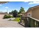 Expansive backyard features a large gray deck, lush lawn, and well-maintained greenery and perimeter plants at 1172 S Steele St, Denver, CO 80210