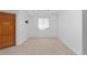 The basement features a large window, light-colored walls, and carpet at 1172 S Steele St, Denver, CO 80210