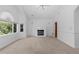Bright Primary bedroom featuring a fireplace, neutral carpet, and ample natural light at 1172 S Steele St, Denver, CO 80210