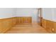 Bedroom features hardwood flooring and custom wood trim, with natural light coming in from the open doorway at 1172 S Steele St, Denver, CO 80210